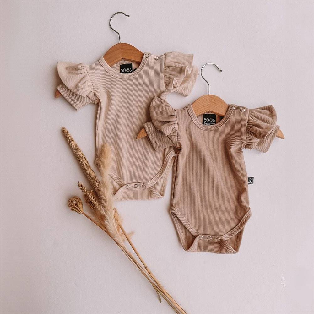 BABYSTYLING ruffle romper sand.